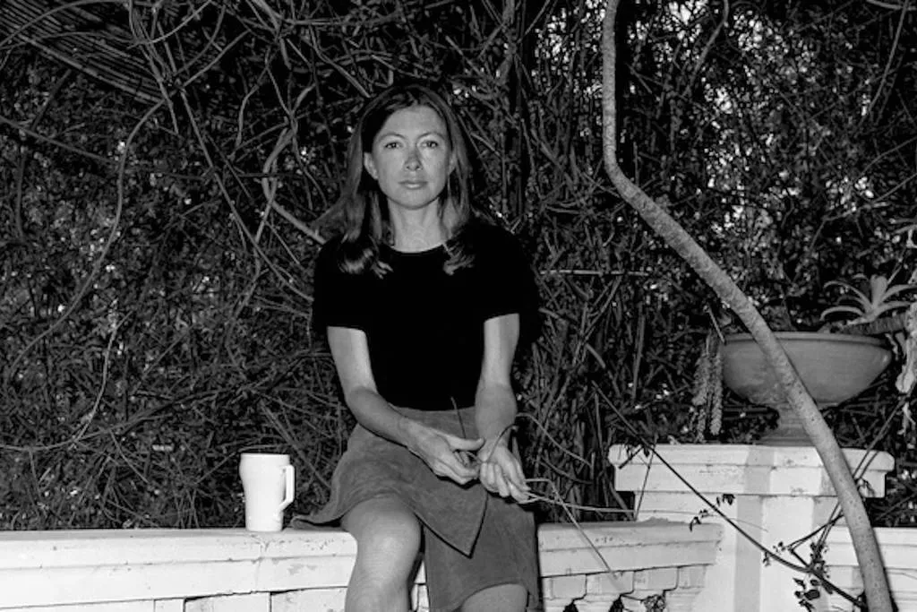 A black and white photo of Joan Didion