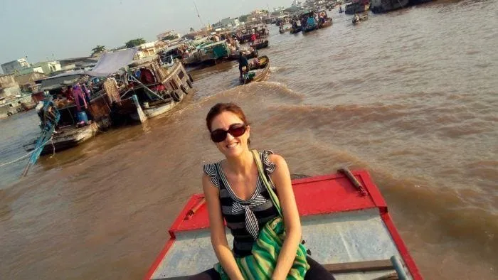 A boat laden with goods at a floating market in Chau Doc, a vibrant scene from the Mekong Delta