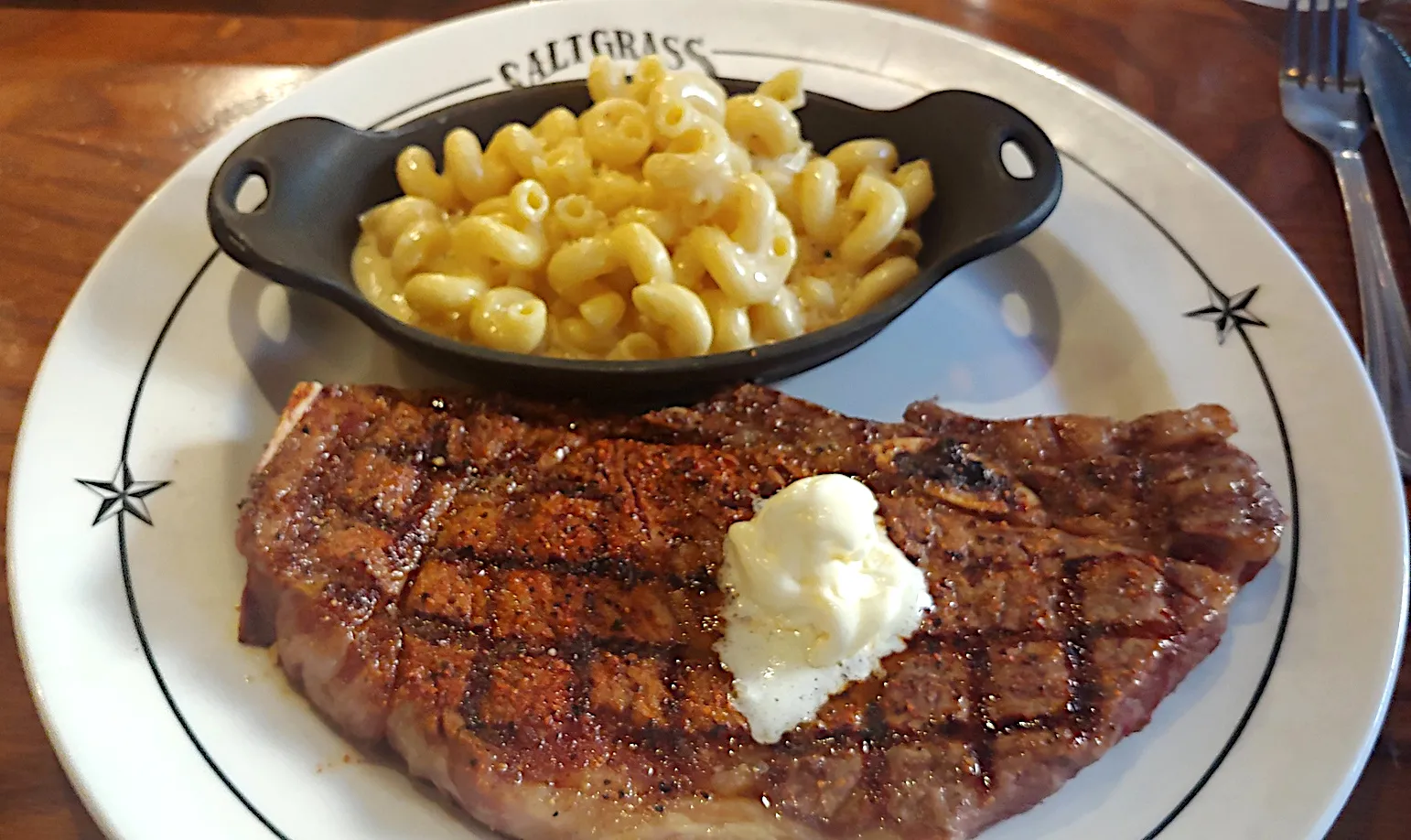 A bone-in steak served on a plate