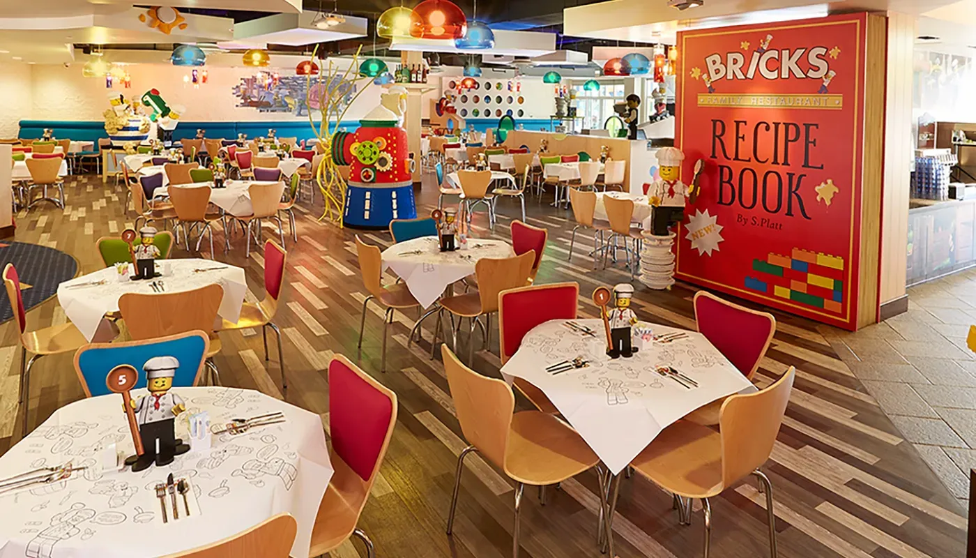 A brightly decorated dining area with tables and chairs.