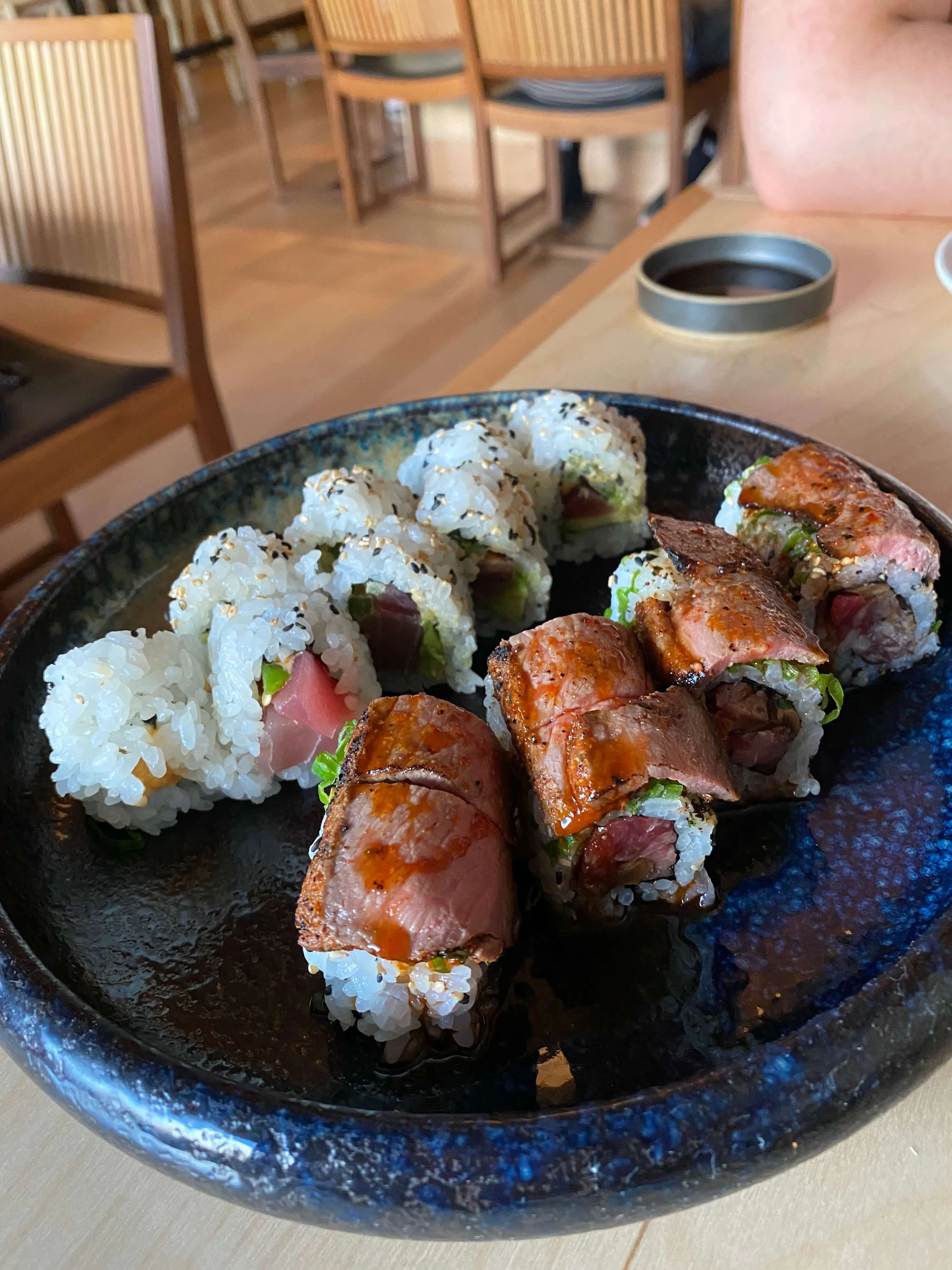 A colorful arrangement of sushi rolls and nigiri at Neighborhood Sushi on South Congress, Austin