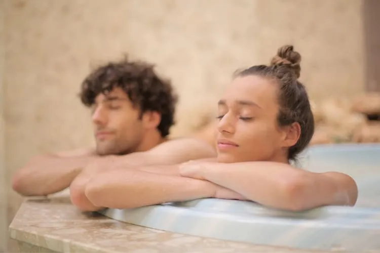 A couple in a pool at a spa, a relaxing and luxurious date idea in Las Vegas