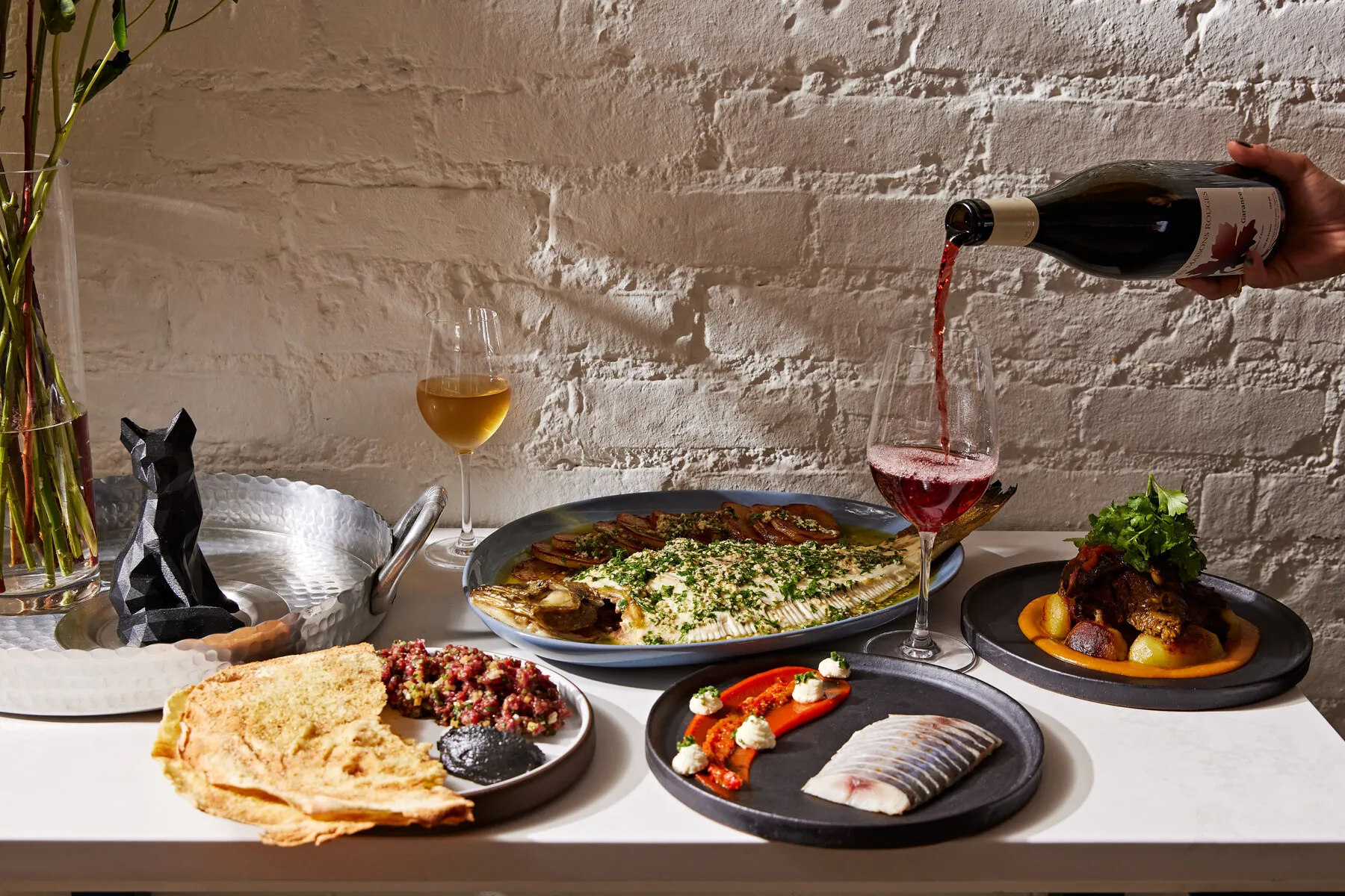 A creatively plated dish from Foxface Natural, potentially featuring game meat or unusual vegetables.