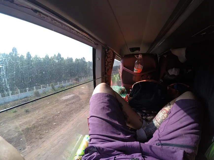 A pair of legs on a bus in Asia