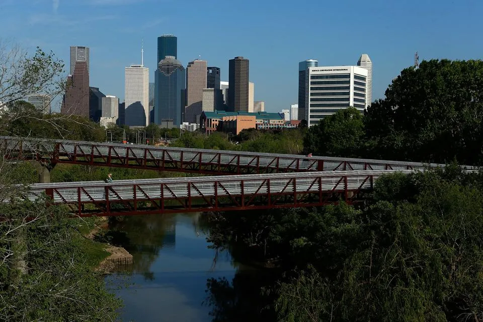 A panoramic view of the Houston skyline from Buffalo Bayou Park, a contender for whats the best city in texas