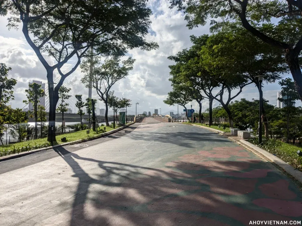 A path through the trees toward the Nguyen Van Troi Walking Bridge in Da Nang, Vietnam.
