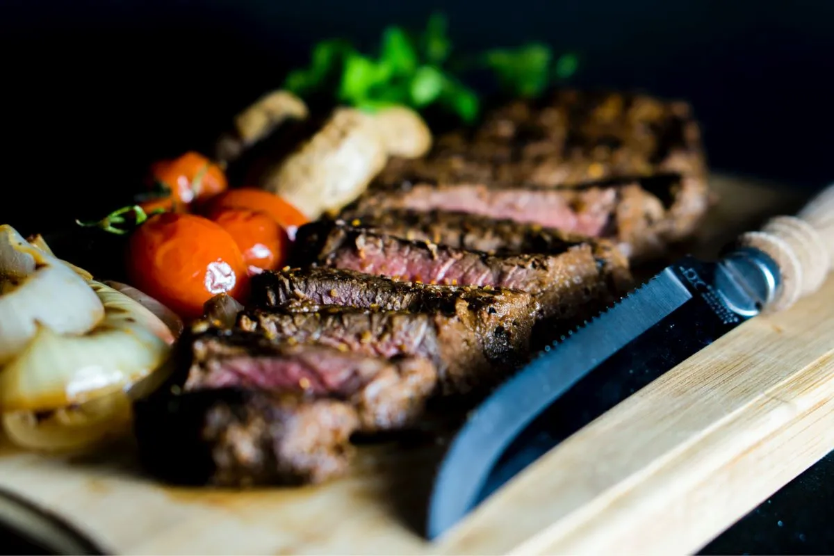 A perfectly cooked porterhouse steak, a classic New York famous food steakhouse dish