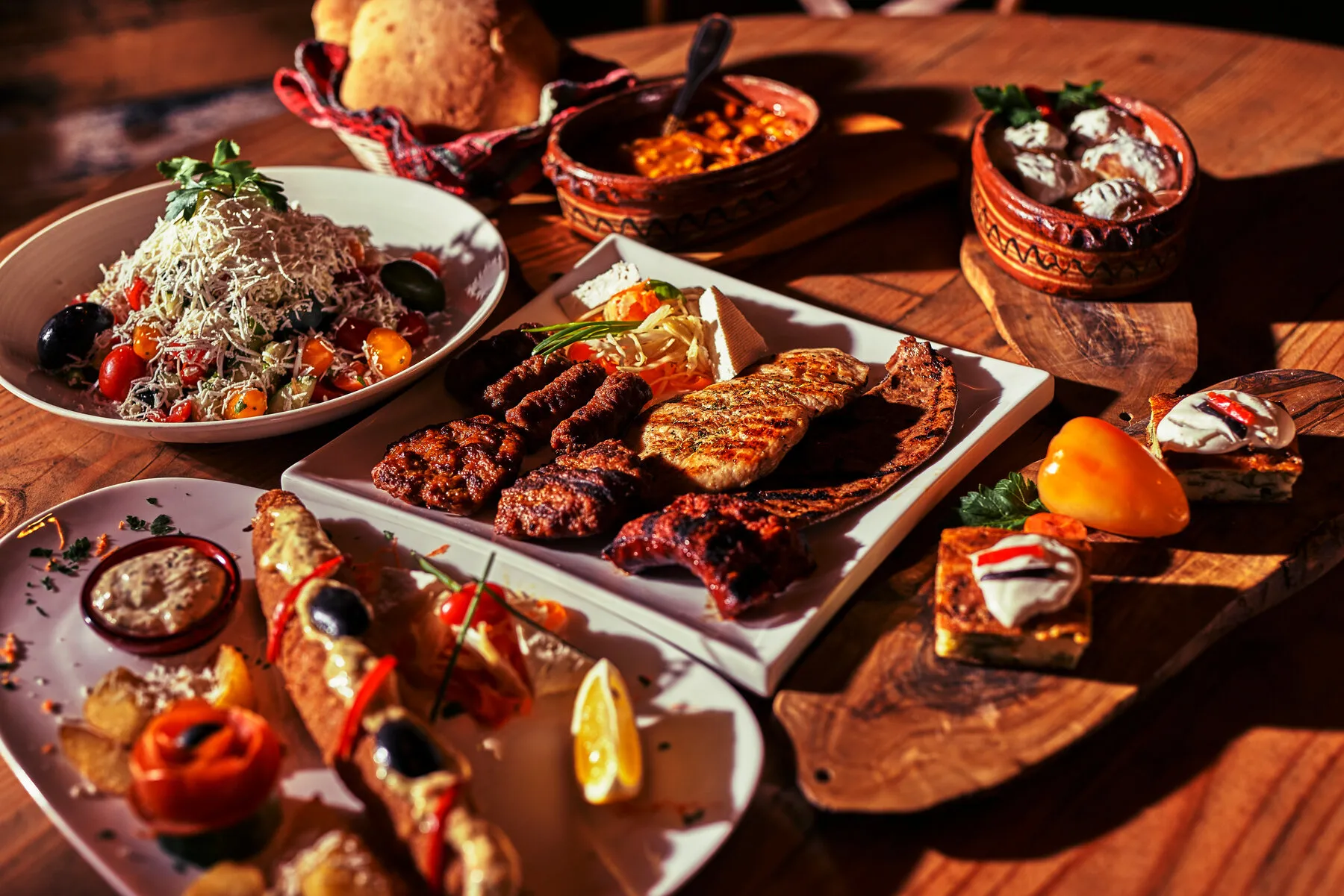 A platter of Albanian grilled meats and side dishes from Cka Ka Qellu.