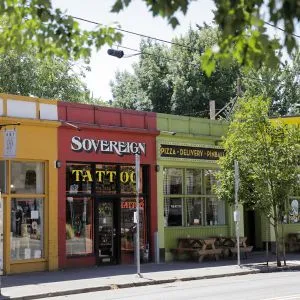 A row of colorful storefronts along Southeast Division Street in Portland