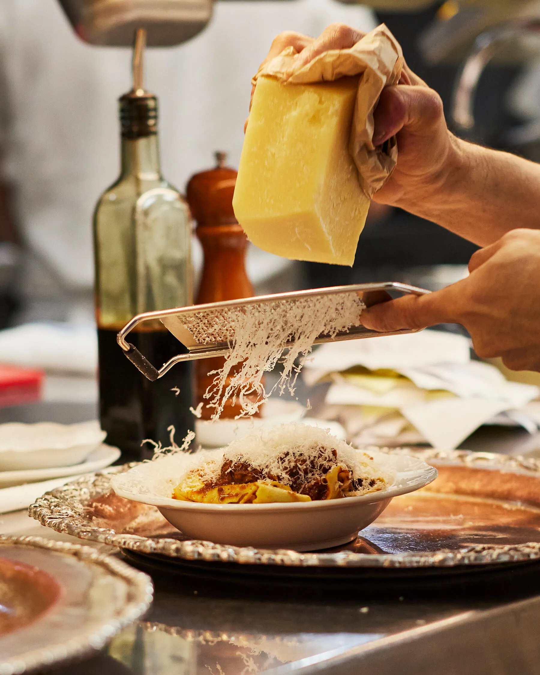 A rustic Italian dish from Via Carota featuring pasta or a meat preparation, presented in a simple yet inviting manner.
