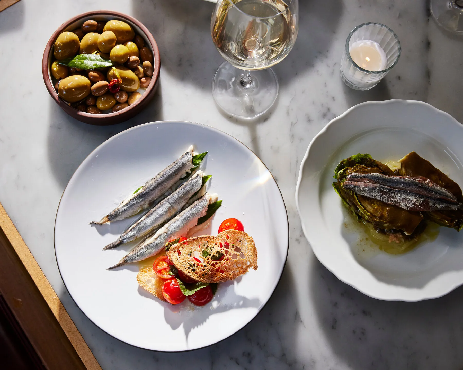 A selection of Basque tapas from Txikito, featuring small plates with diverse ingredients.