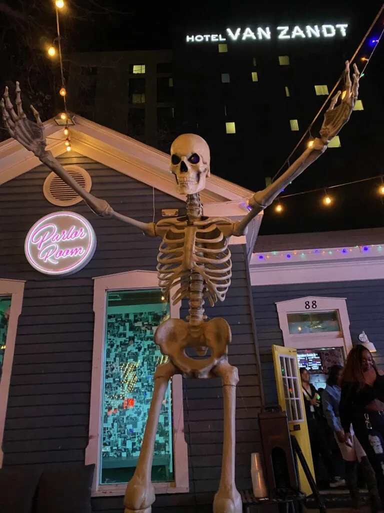 A skeleton figure seen on Rainey Street in Austin, hinting at the street's unique and lively atmosphere.