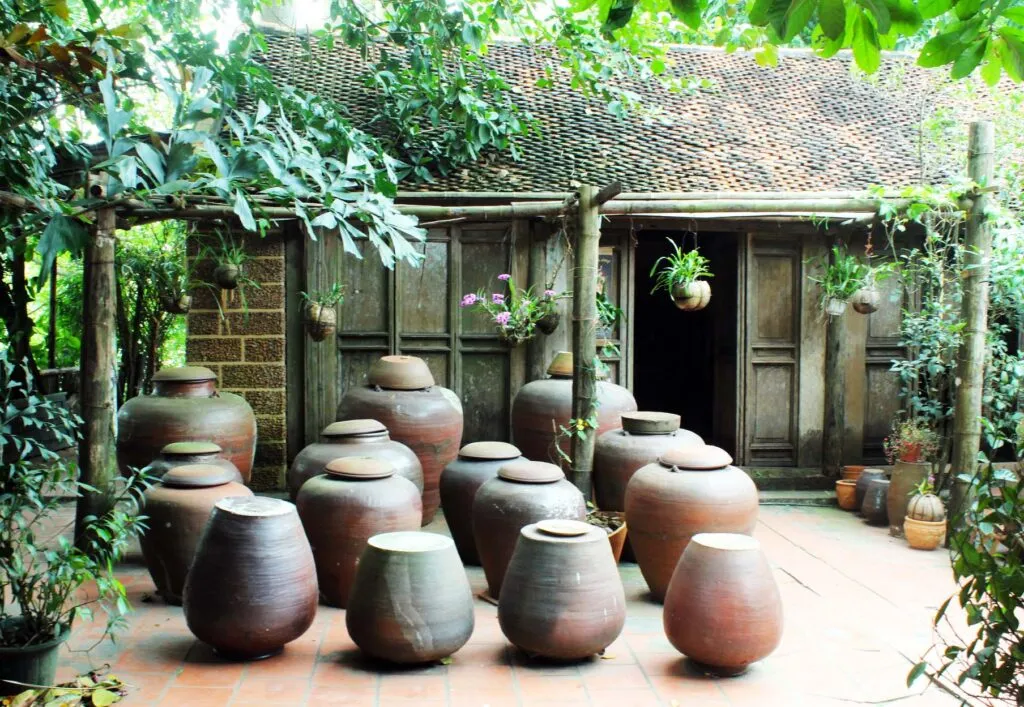 A traditional home at Duong Lam Ancient Village showcasing historic laterite brick architecture