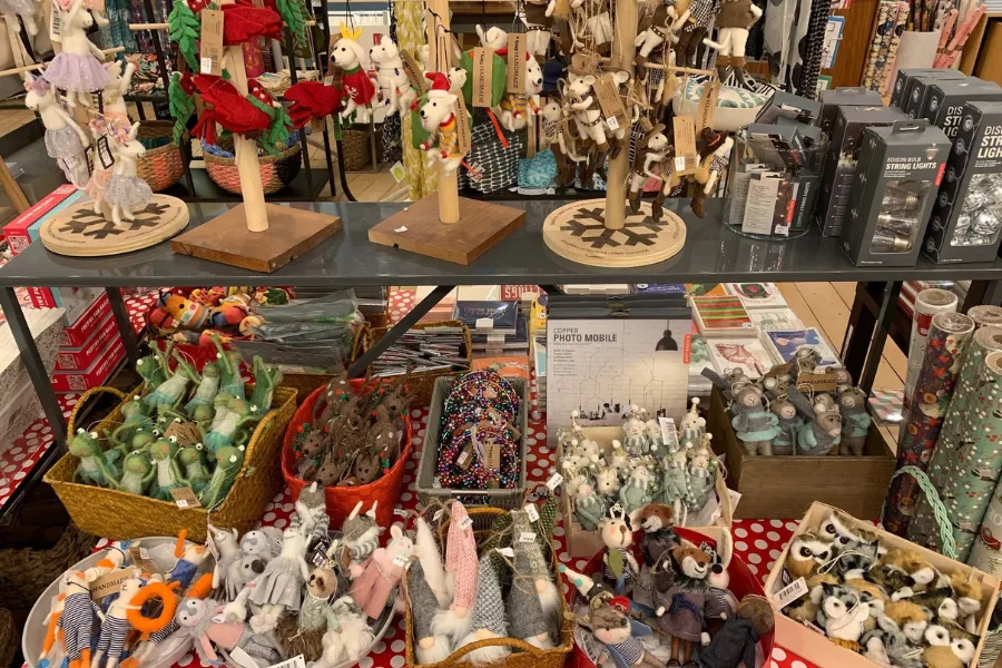 A vendor tent brightly lit at the Dupont Circle Holiday Pop-up market