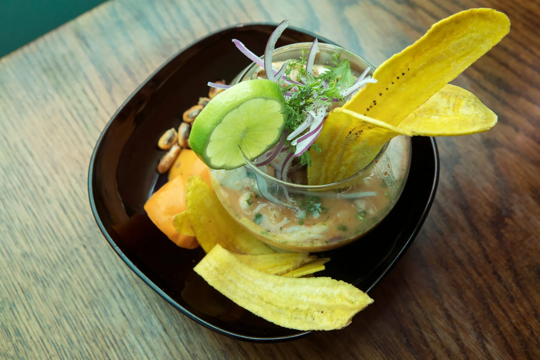 A vibrant ceviche dish from Caleta 111, highlighting the seafood and citrus broth.