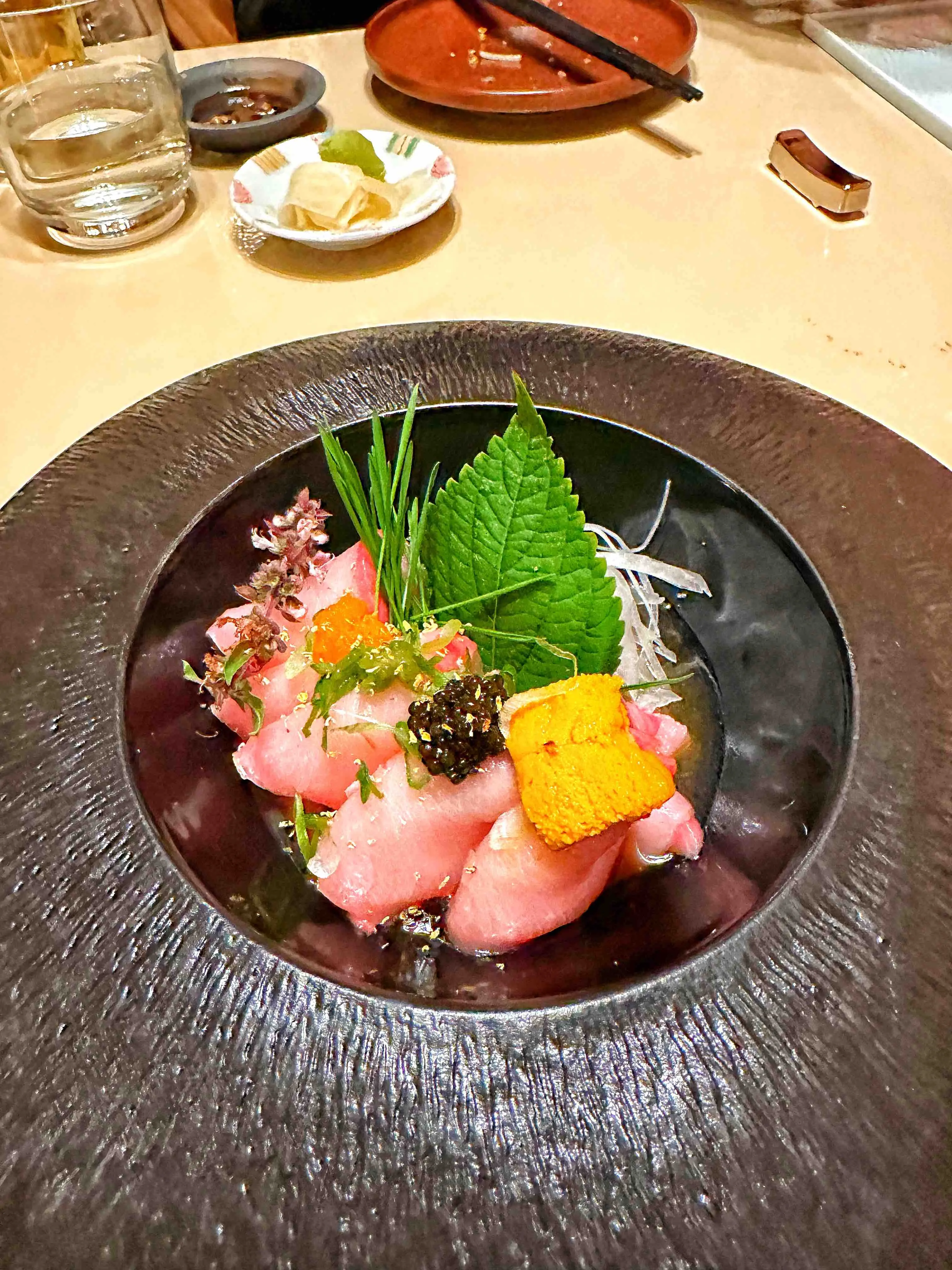 A vibrant sushi roll, possibly the Red Crane Roll, served at Kane Sushi in Cedar Park
