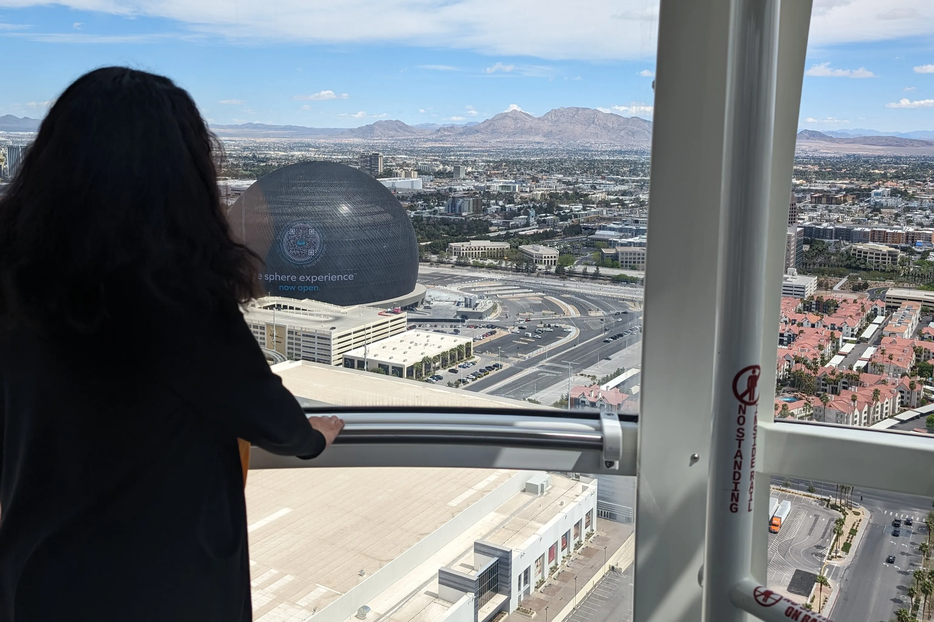 A woman overlooking the Sphere in Las Vegas