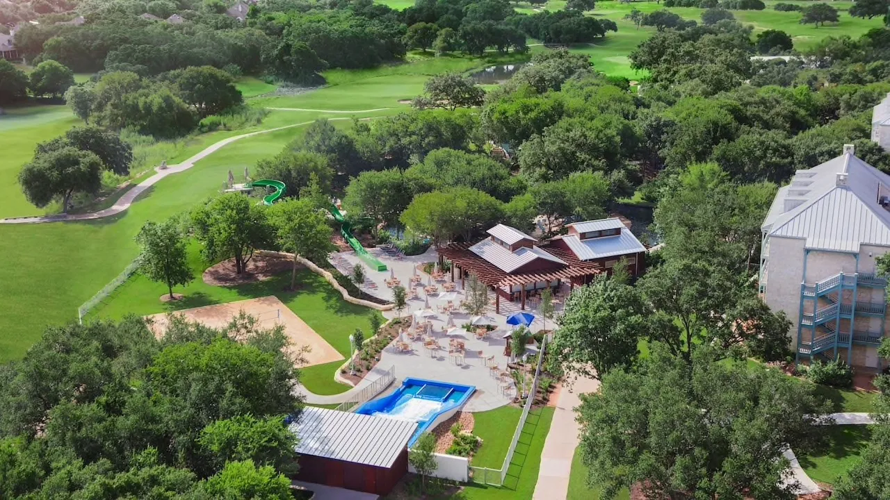 Aerial view of a resort water park with pools and slides