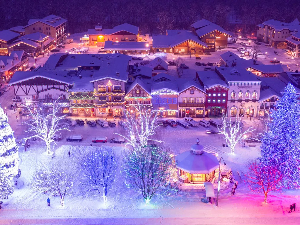 Aerial view of downtown Leavenworth decorated with Christmas lights at night