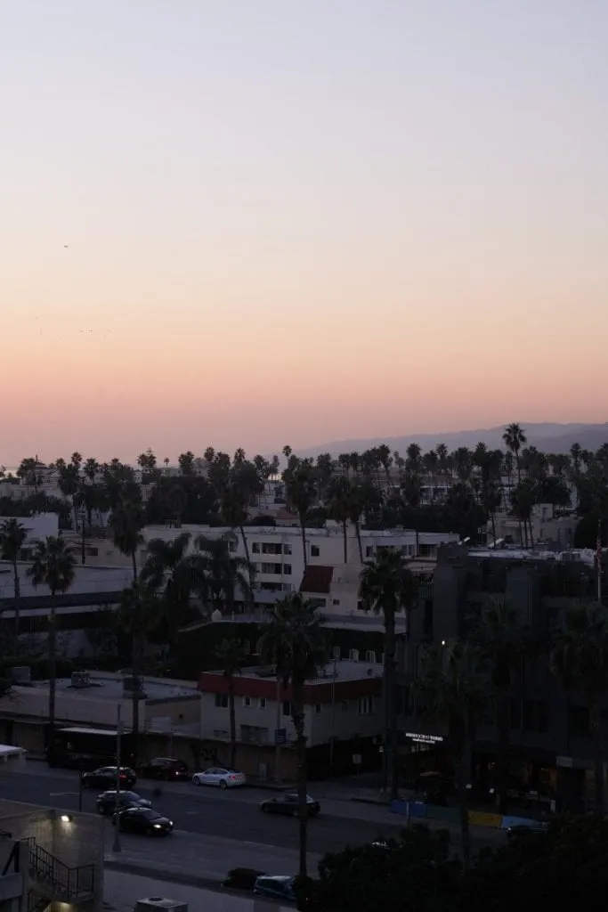 Aerial view of Los Angeles coastline at sunset, reflecting on a la travel guide trip