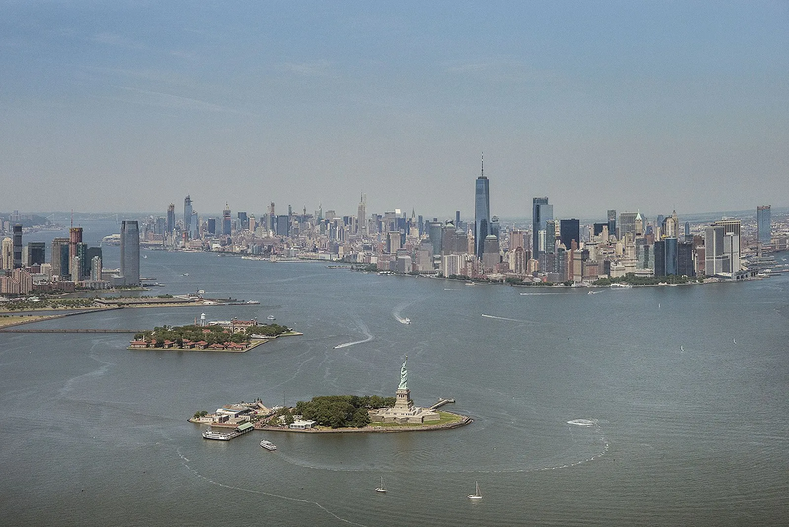 Aerial view of New York Harbor with the Statue of Liberty, Ellis Island, and Manhattan skyline
