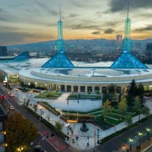 Aerial view of the Oregon Convention Center in Portland's Lloyd District at sunset