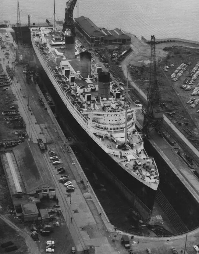 alt text: The iconic Queen Mary ship docked in Long Beach, a prominent landmark among Los Angeles tourist attractions.