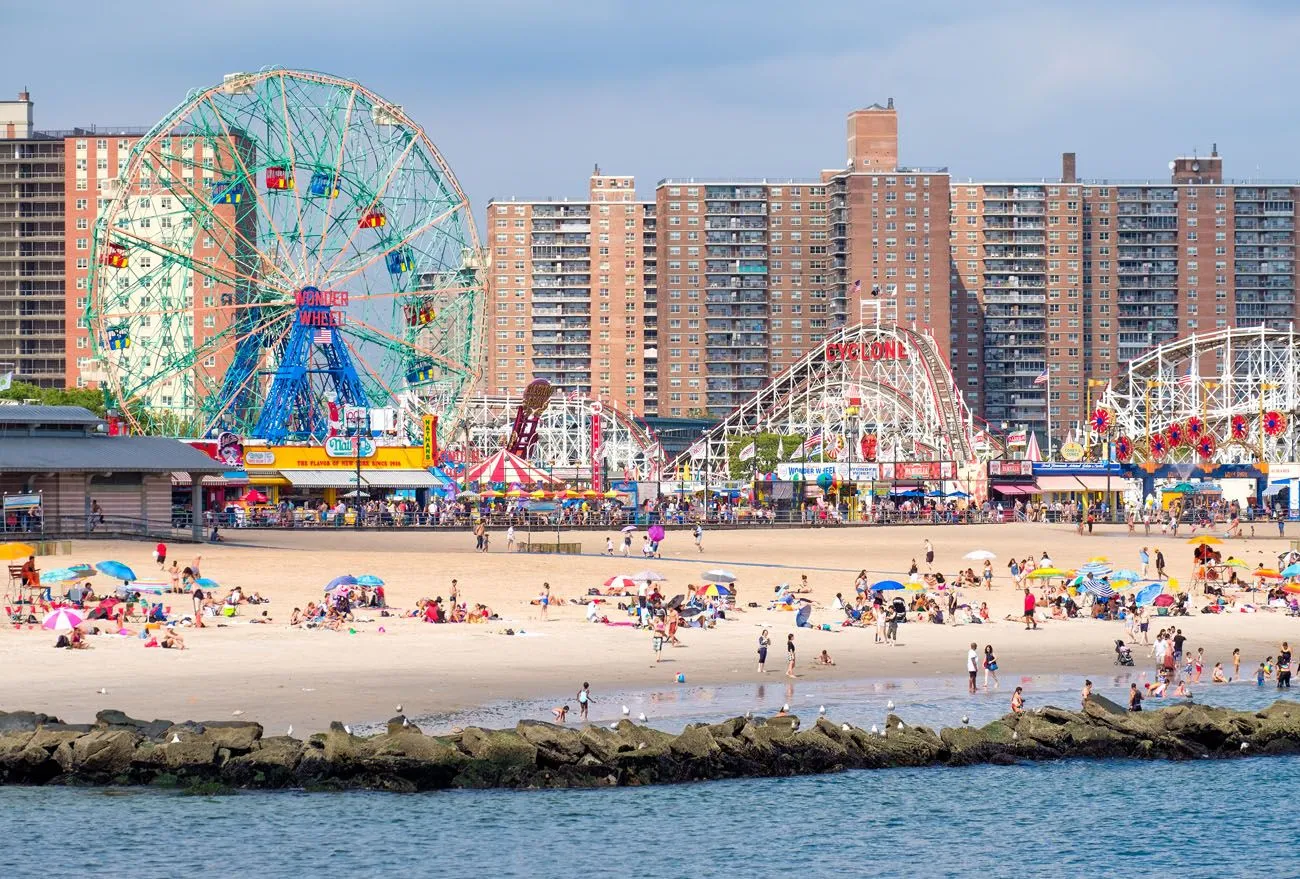 Amusement park rides and beach at Coney Island