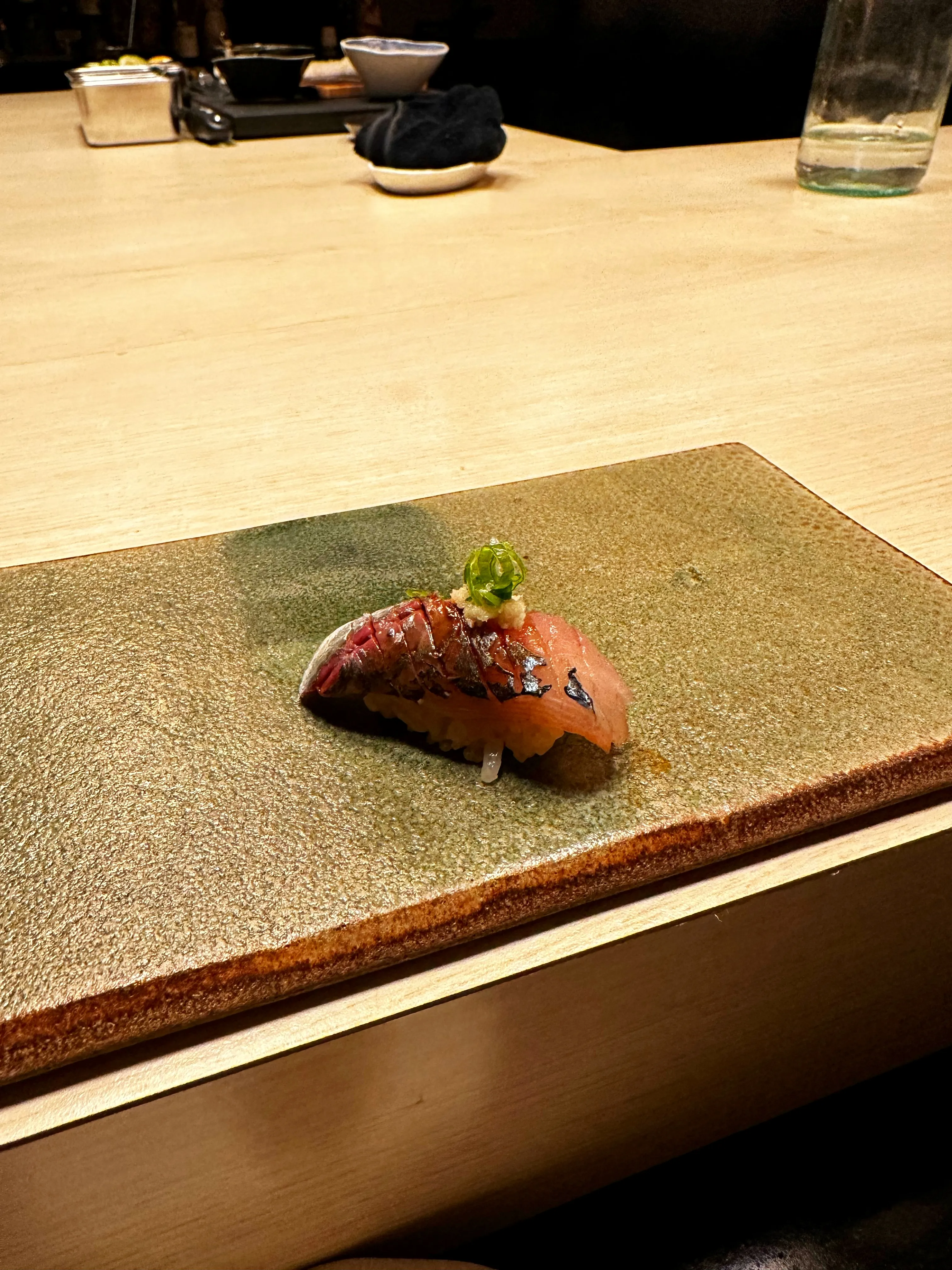 An array of meticulously prepared fusion sushi pieces at Tare Austin