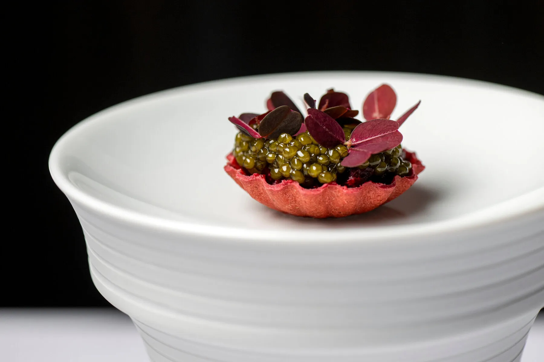 An artfully plated course from Clover Hill, featuring delicate ingredients arranged with precision.