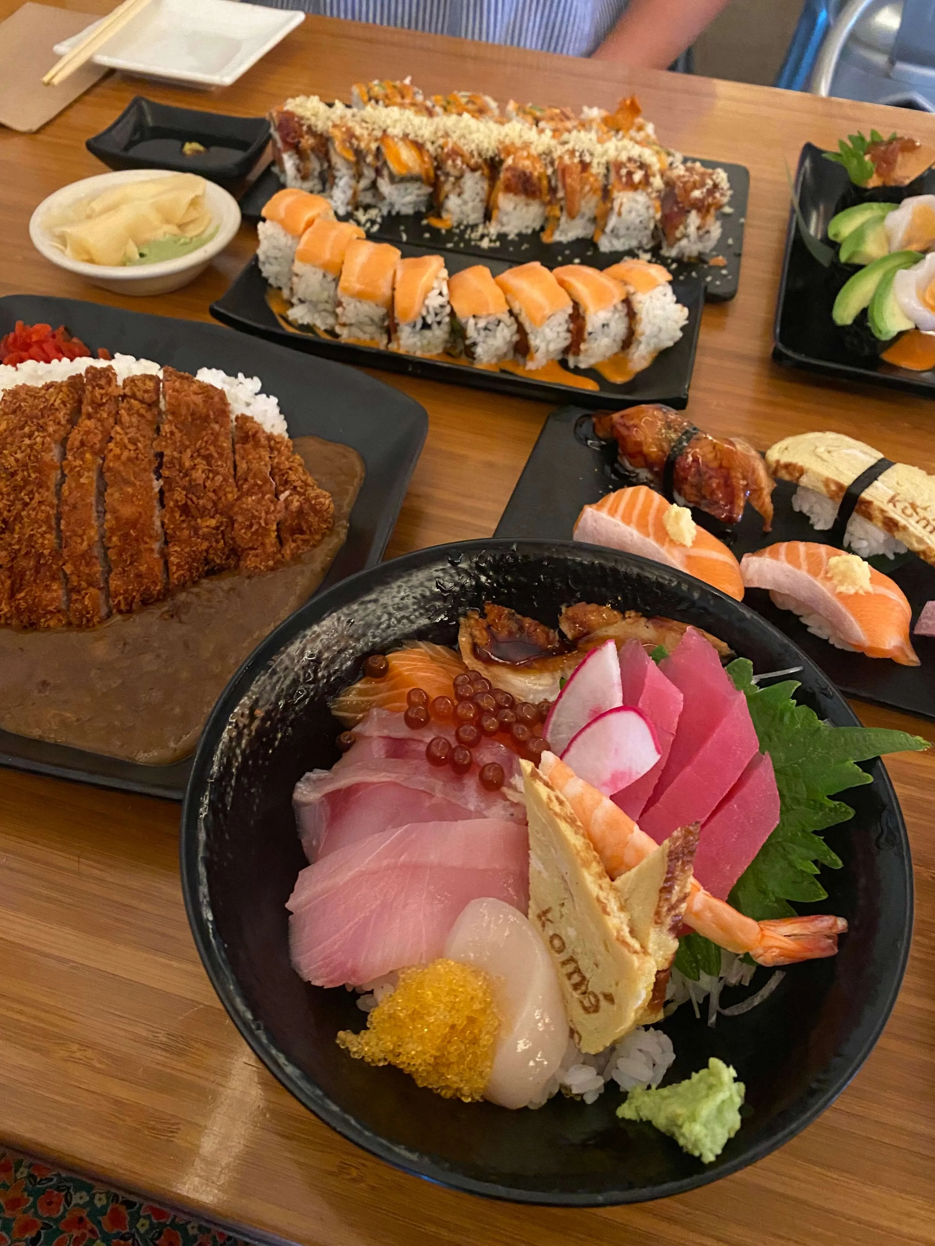 Another view of delicious and unique sushi rolls presented on a plate at Kome Austin