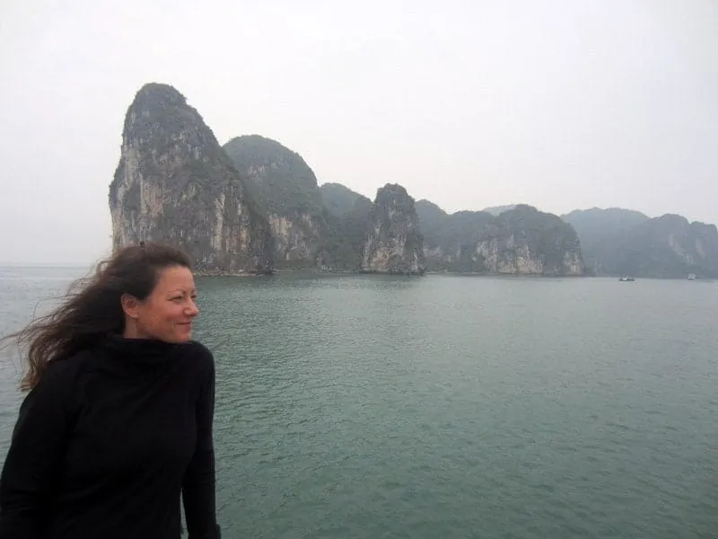 Another view of the incredible Ha Long Bay landscape with a boat cruising between islets