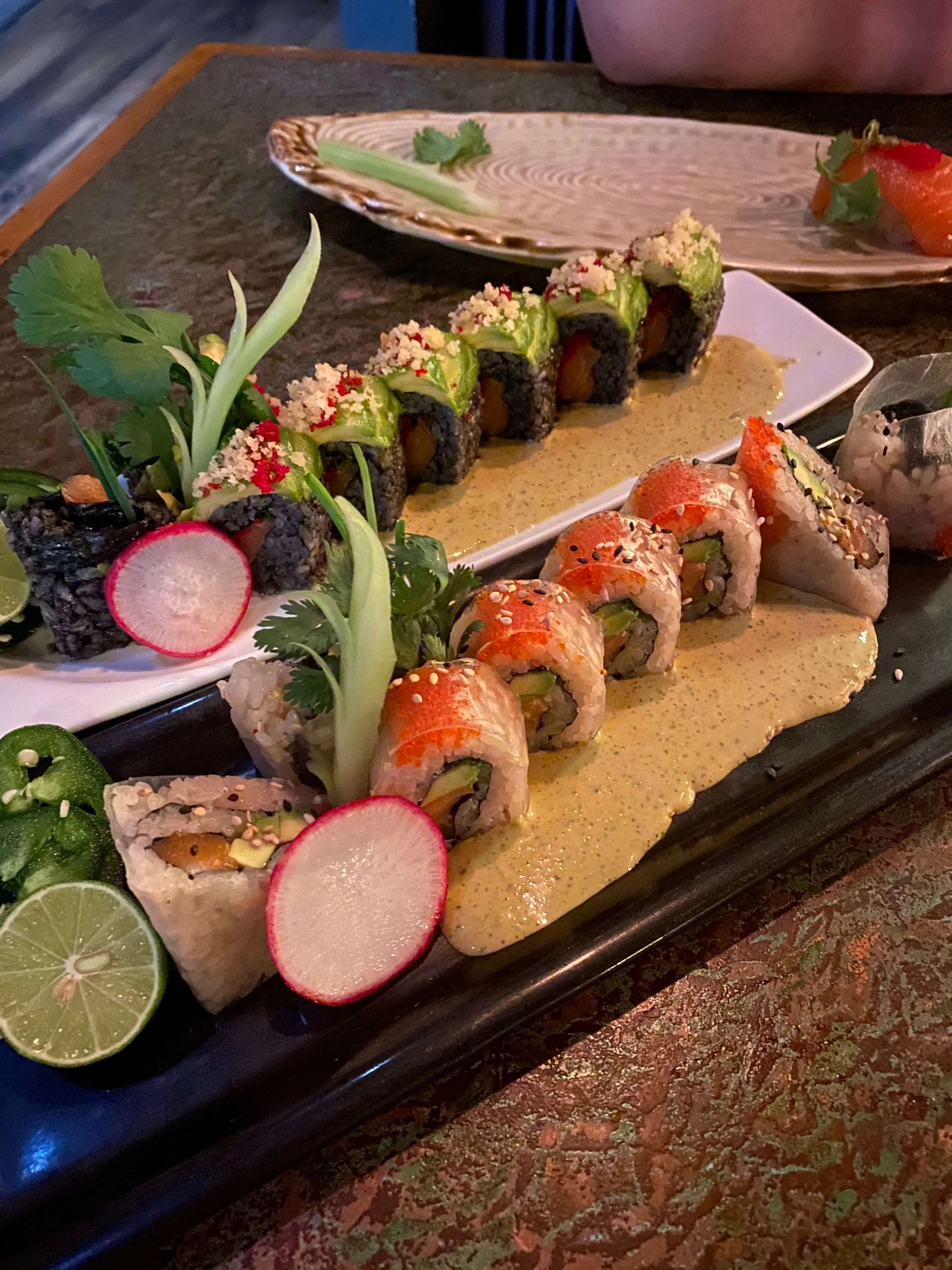 Assortment of sushi rolls and nigiri on a plate at Musashino Sushi Dokoro in Austin
