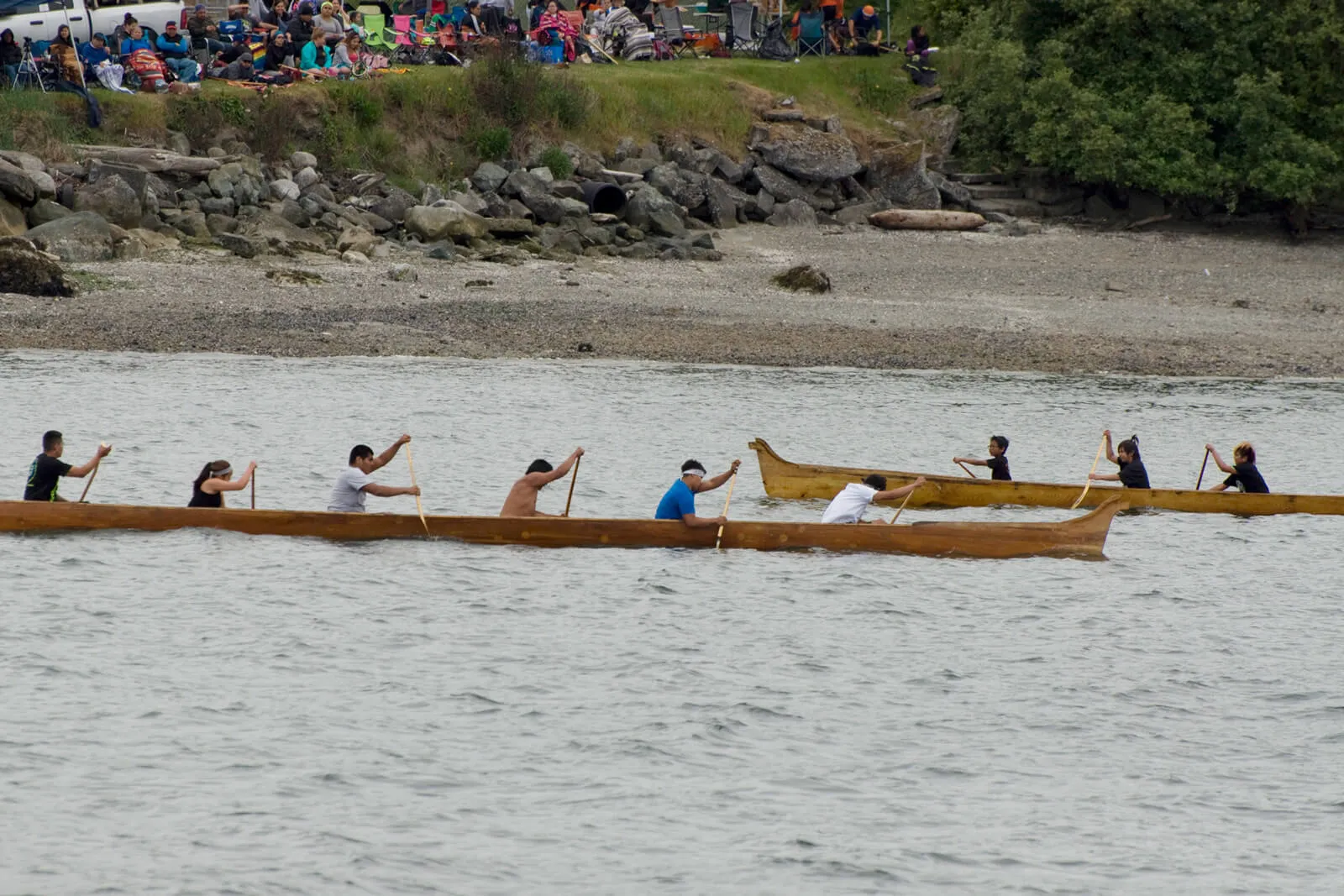 Athletes competing in a canoe race