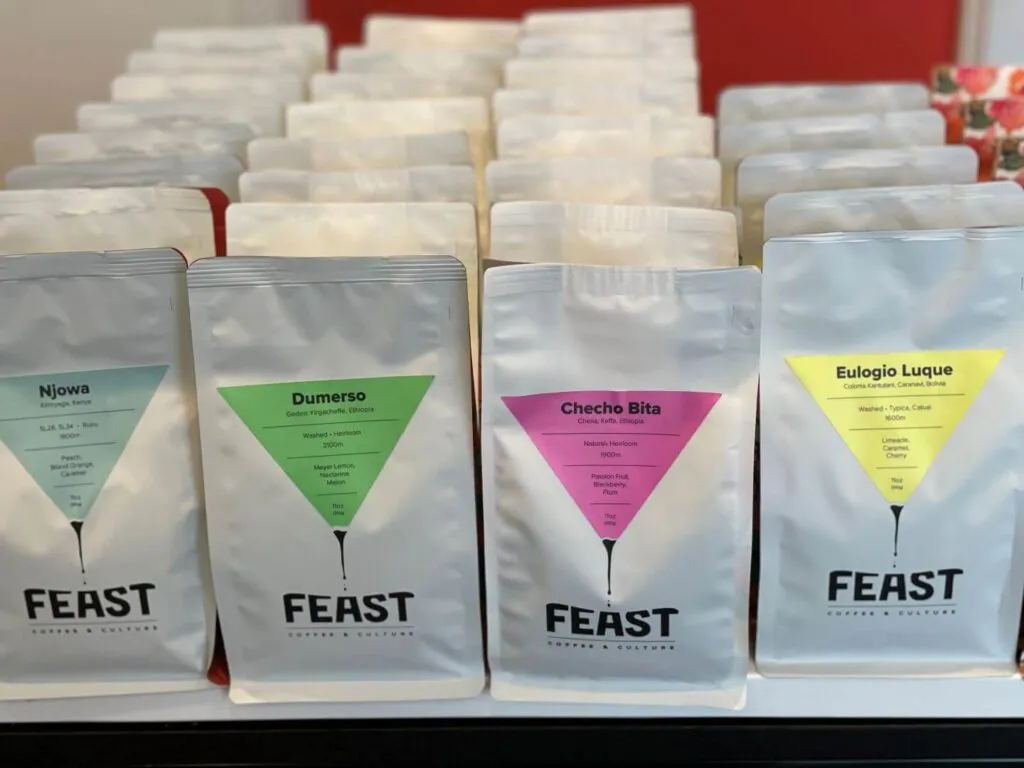 Bags of Feast Coffee beans displayed for sale inside Evergreen coffee shop in Redding
