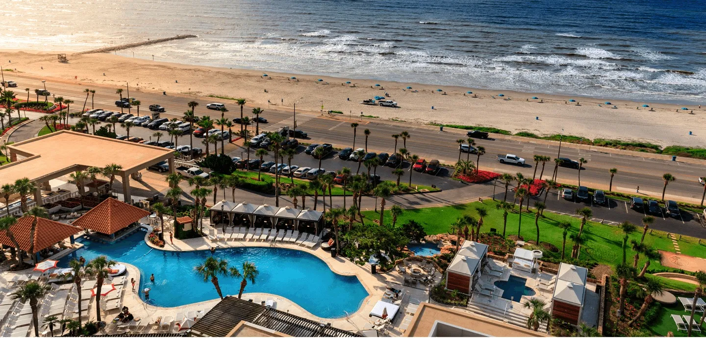 Beachfront resort with multiple pools and palm trees