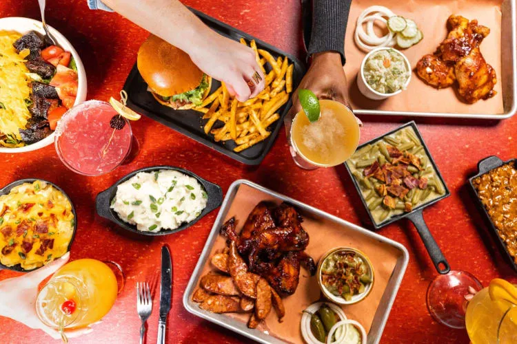 Bone Daddy BBQ platter featuring smoked meats, a must-try for what to eat Arlington TX