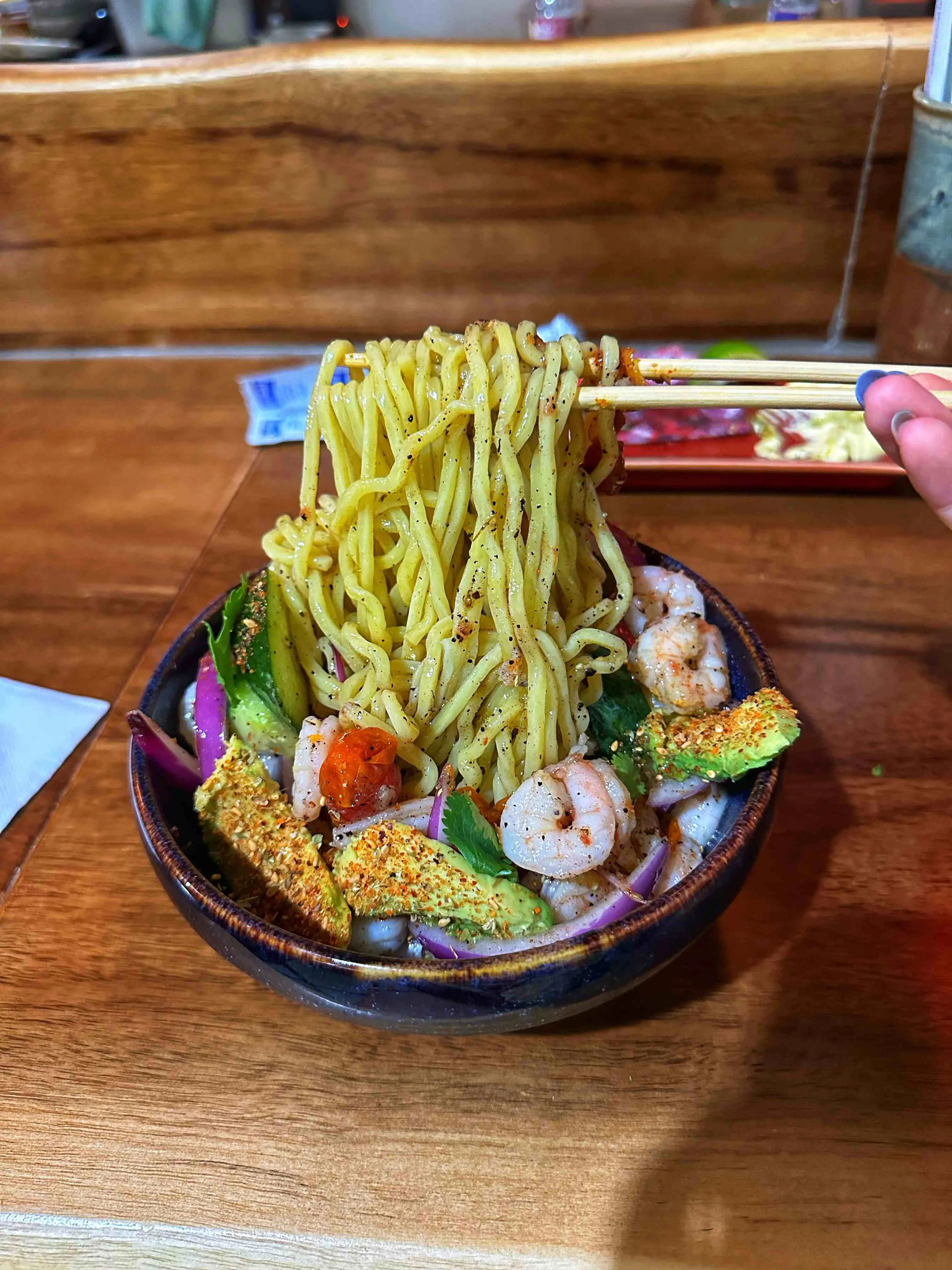 Bowl of fusion ramen with various toppings from Ramen Del Barrio in Austin