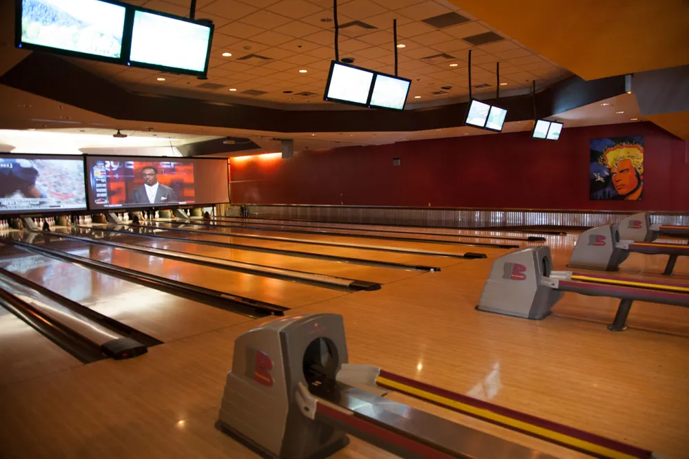 Bowlers on lanes at Slopeside Lanes, a fun spot among Snowmass restaurants