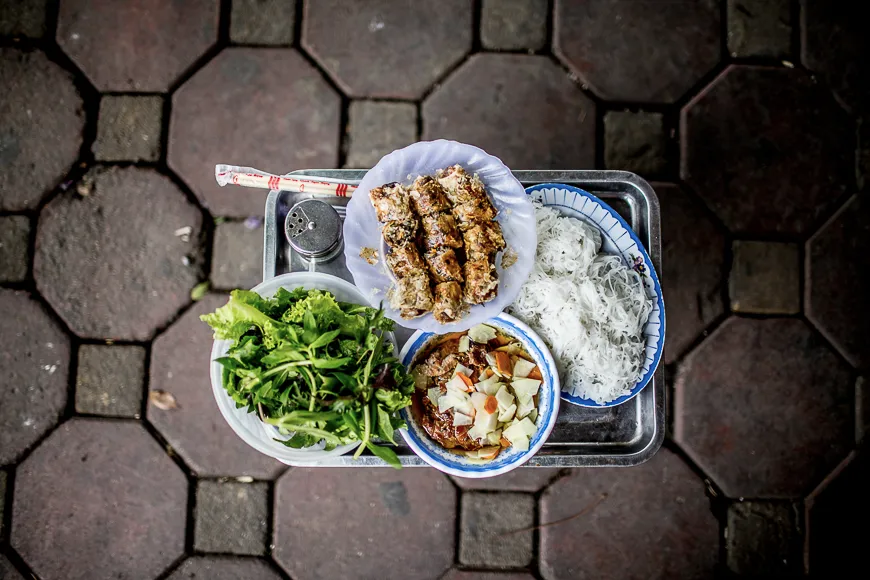Bun Cha, grilled pork patties and sliced pork belly served with vermicelli noodles and dipping broth