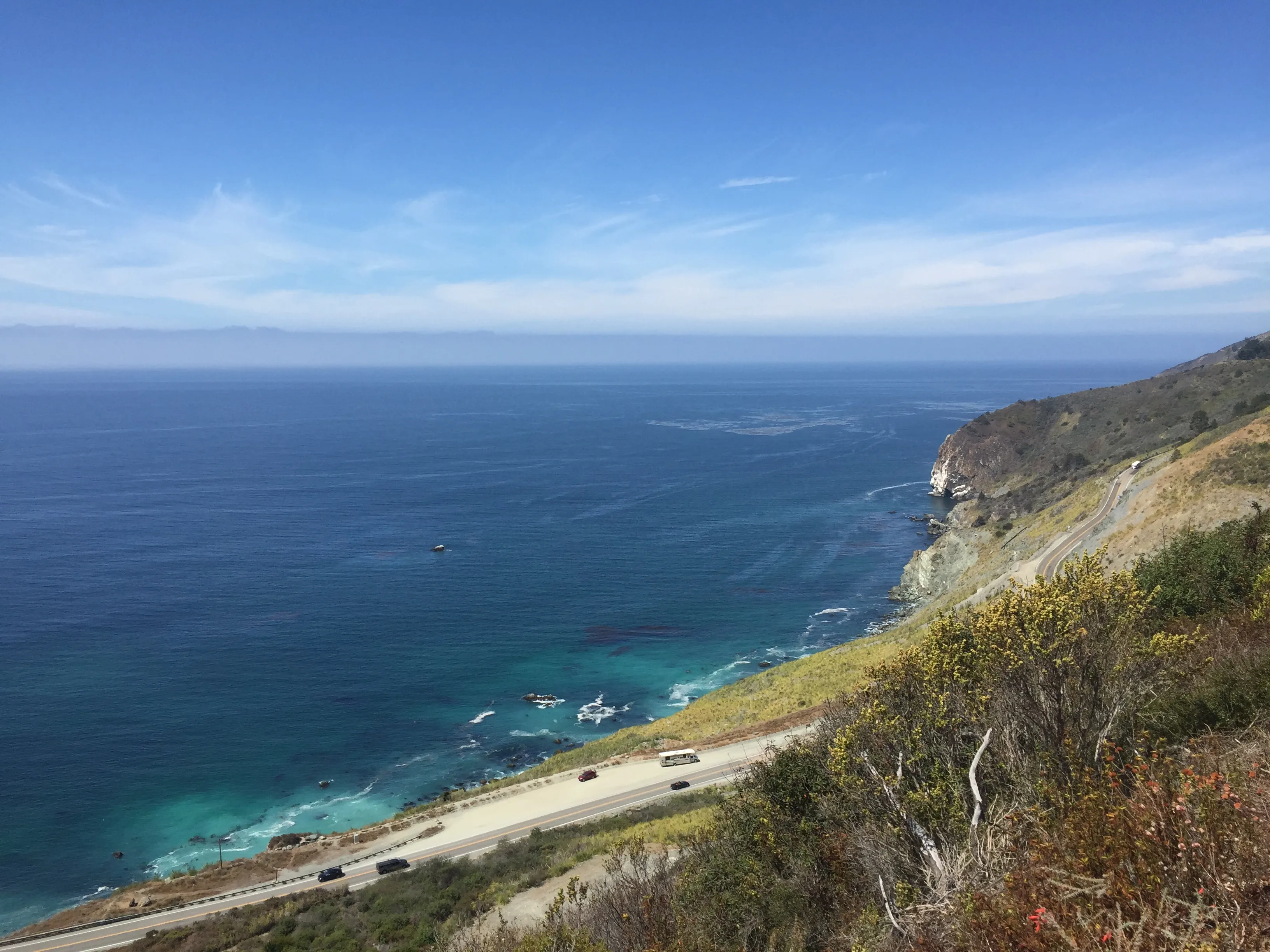 Campsite on a grassy slope overlooking the ocean in Big Sur