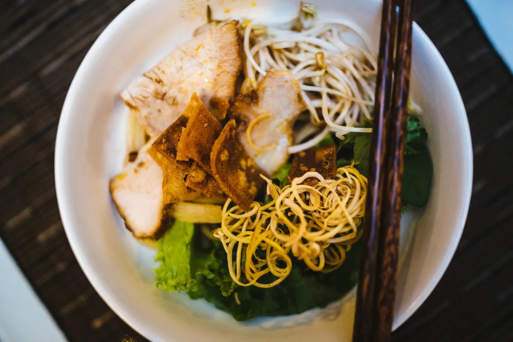 Cao Lau noodles with barbecued pork, herbs, and croutons in Hoi An, Vietnam