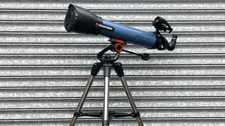 Celestron Inspire 100AZ refractor telescope on a white background with accessories