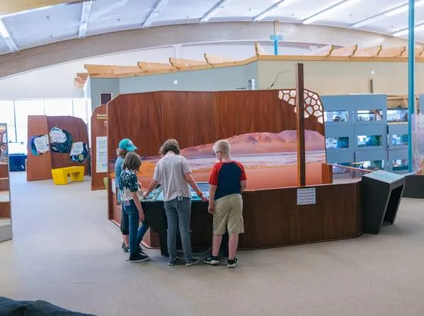 Child interacting with an exhibit at The Science Zone, a family fun thing to do in Casper Wy