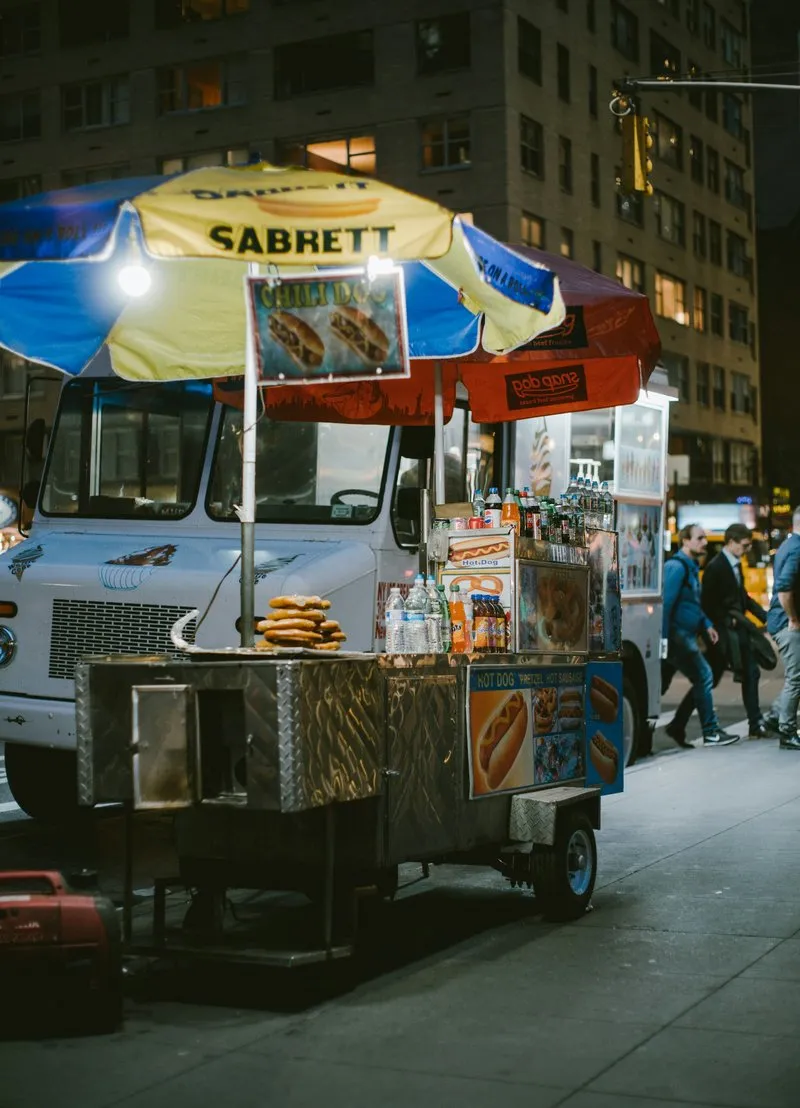 Classic New York City hot dog stand on a street corner