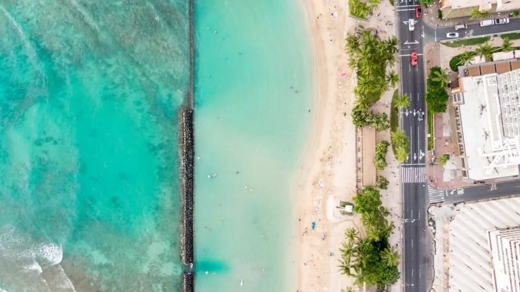 Clear, calm waters behind the concrete walls at Kūhiō Beach, making it ideal for family swimming near the Best Beach In Honolulu