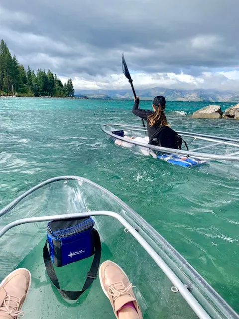 Clear kayak on the water with a person inside
