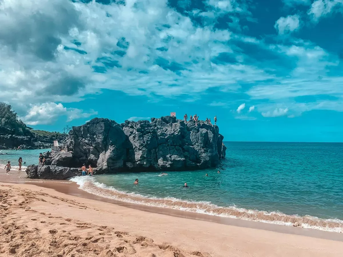 Cliff jumping at Waimea Bay, North Shore Oahu