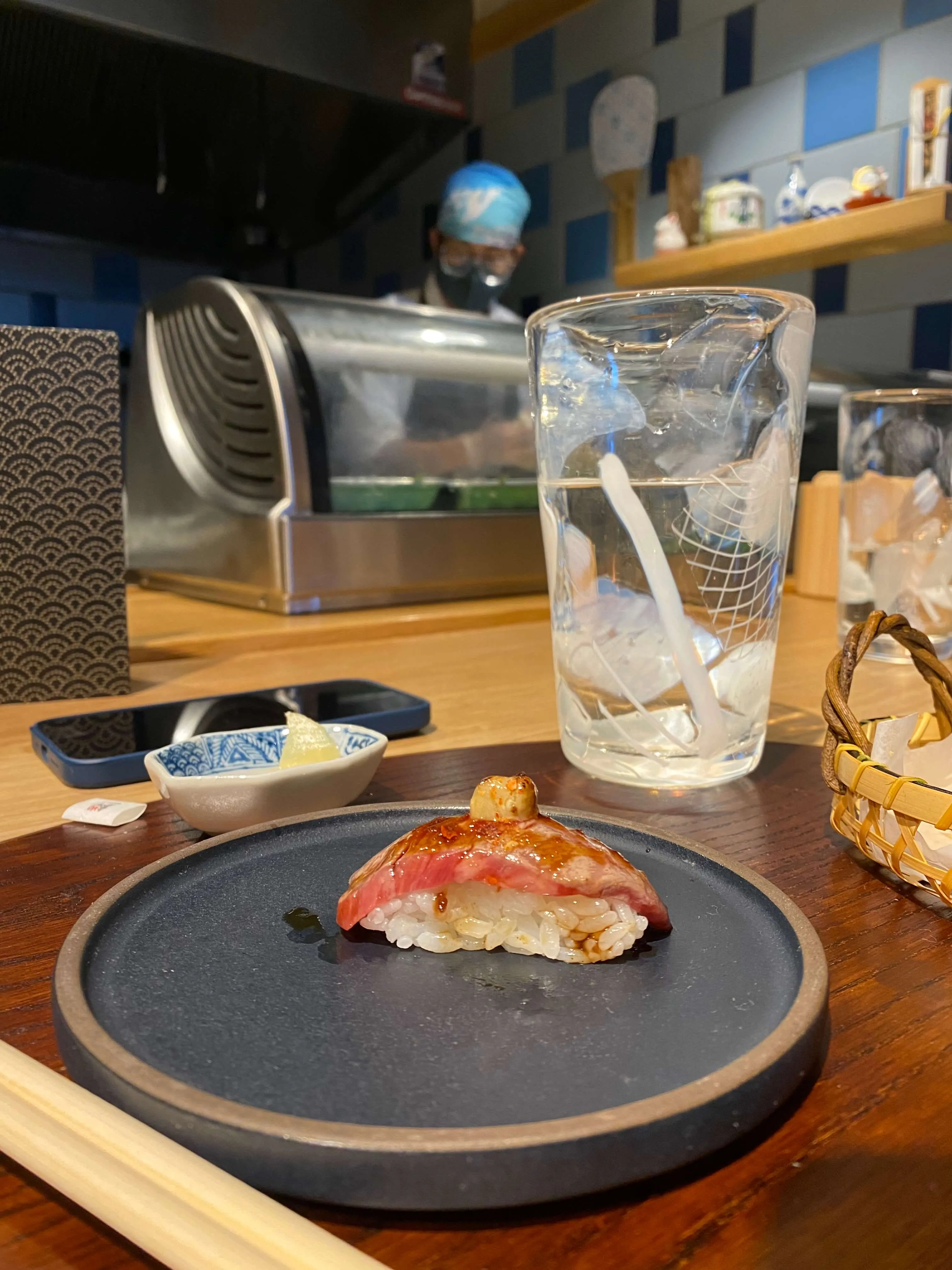 Close-up of a nigiri piece from the Tonari omakase experience at Uroko Austin