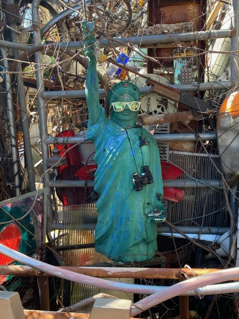 Close-up of a quirky Statue of Liberty sculpture made from junk at the Cathedral of Junk.